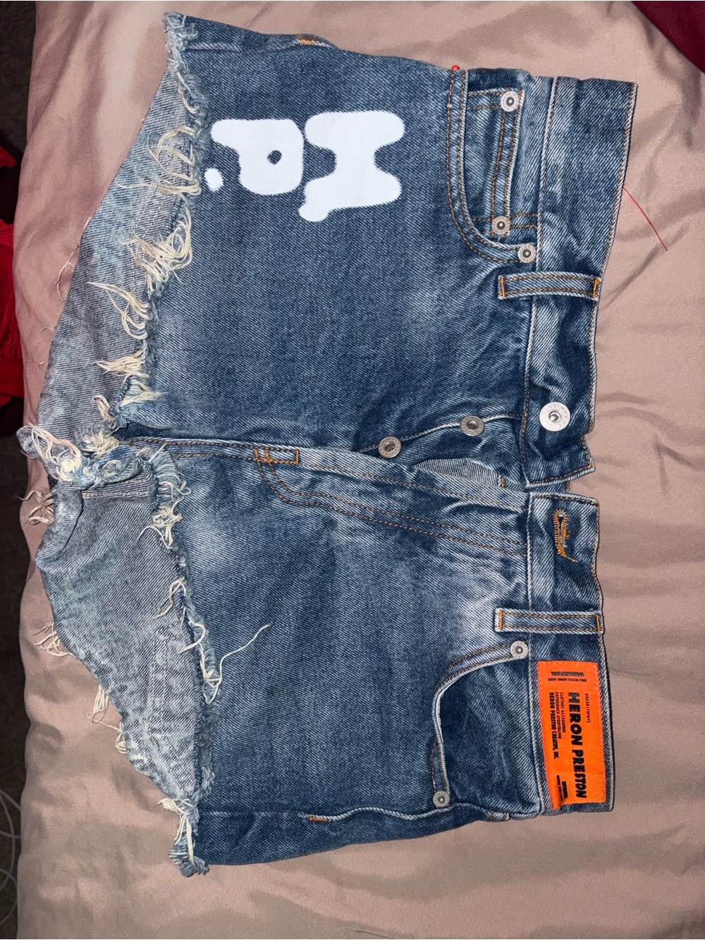 Heron Preston Blue Distressed Denim Shorts with White Graphic and Orange Patch